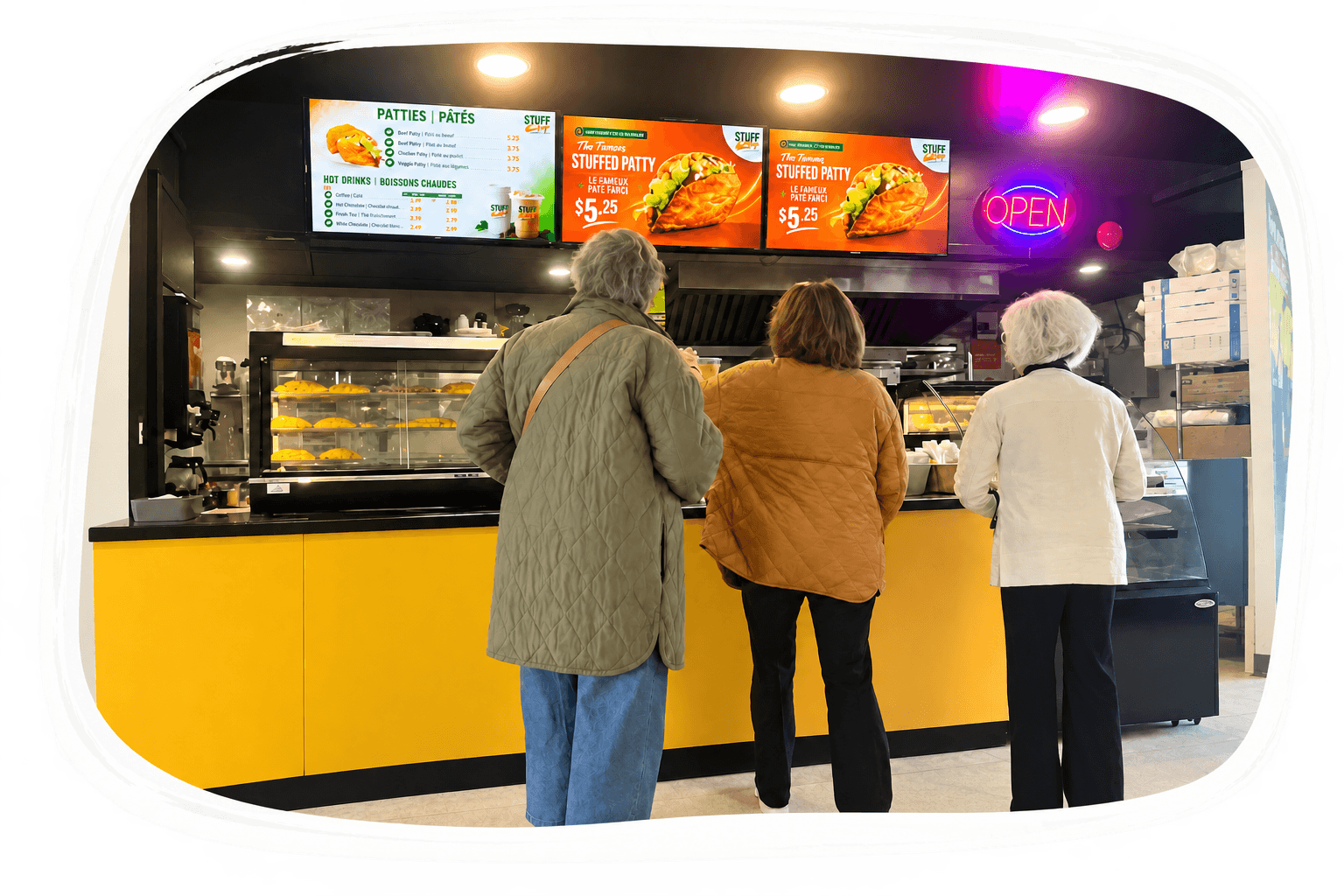 Customers ordering fresh café favourites at the Stuff It Up counter